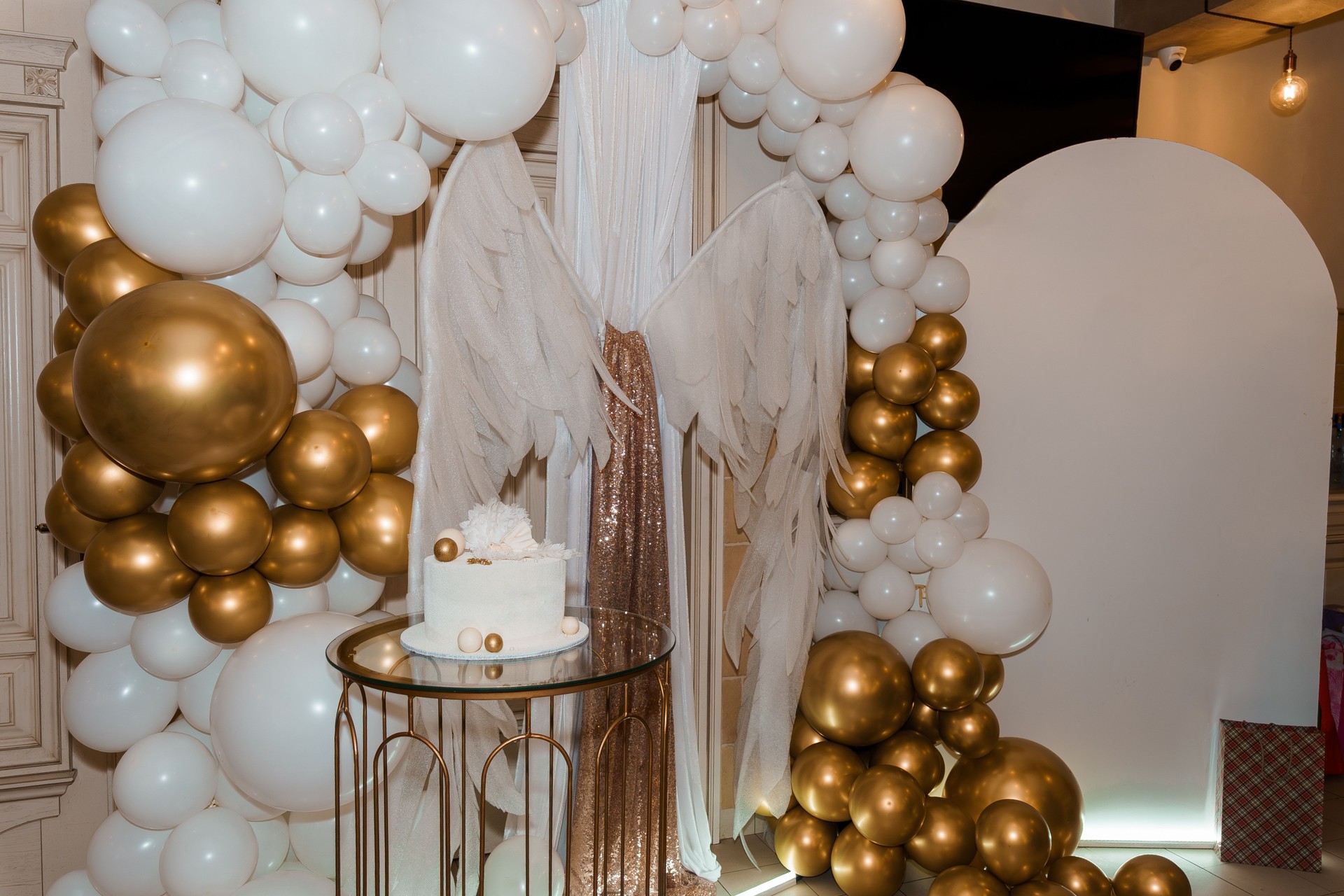 Angel Themed First Birthday Party with White Balloon Arch, Gold Accents and Cake. Celebration, Angel Wings, Modern Decor, Event Styling